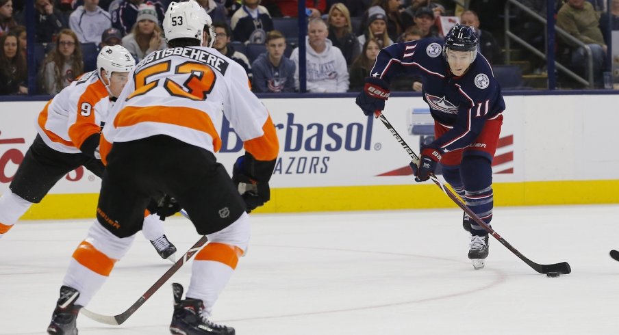 Matt Calvert gets a shot off between a couple of Philadelphia Flyers