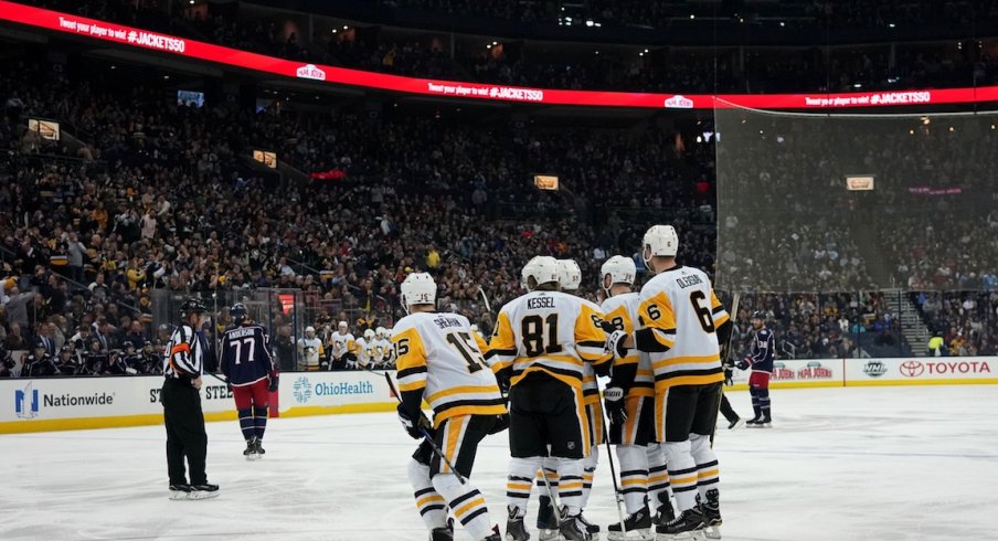 The Pittsburgh Penguins celebrate scoring a goal during the first period of their game against the Blue Jackets
