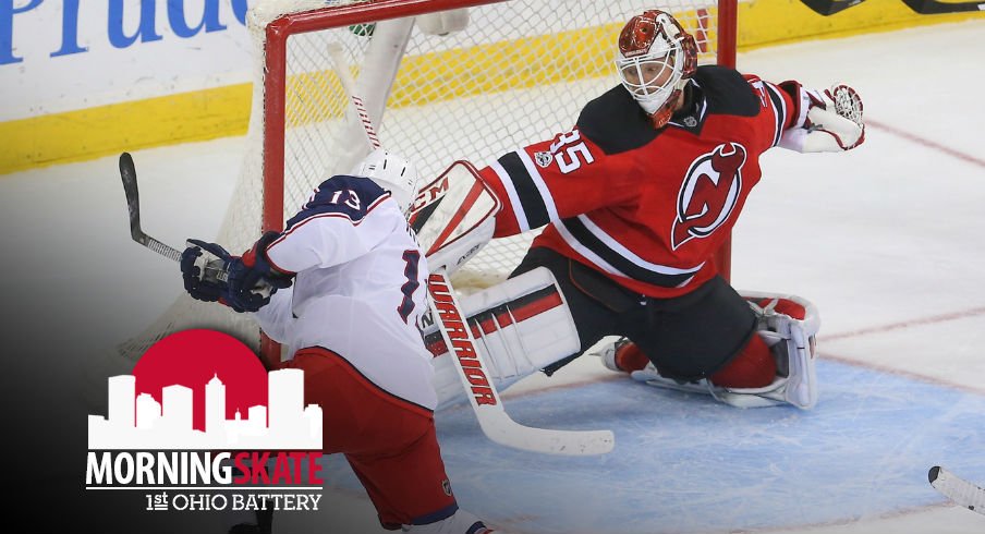 Cam Atkinson takes a shot against New Jersey Devils goaltender Cory Schneider