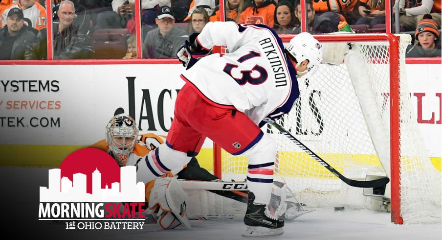 Cam Atkinson slides a puck past Steve Mason on the breakaway