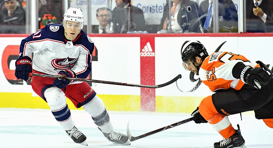 Matt Calvert goes for a puck against the Philadelphia Flyers 