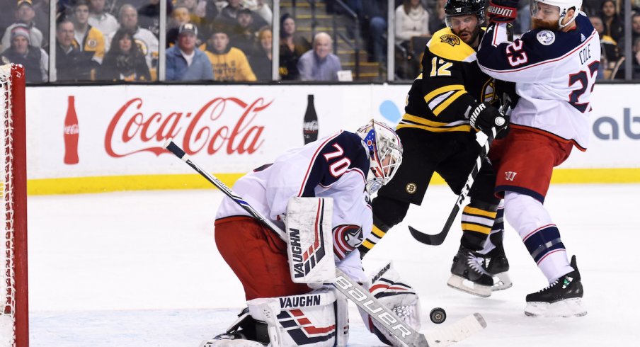 Blue Jackets defenseman Ian Cole boxes out in front Joonas Korpisalo