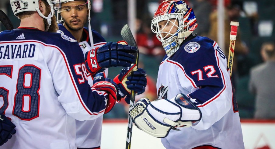 Sergei Bobrovsky and the Blue Jackets celebrate a road win.