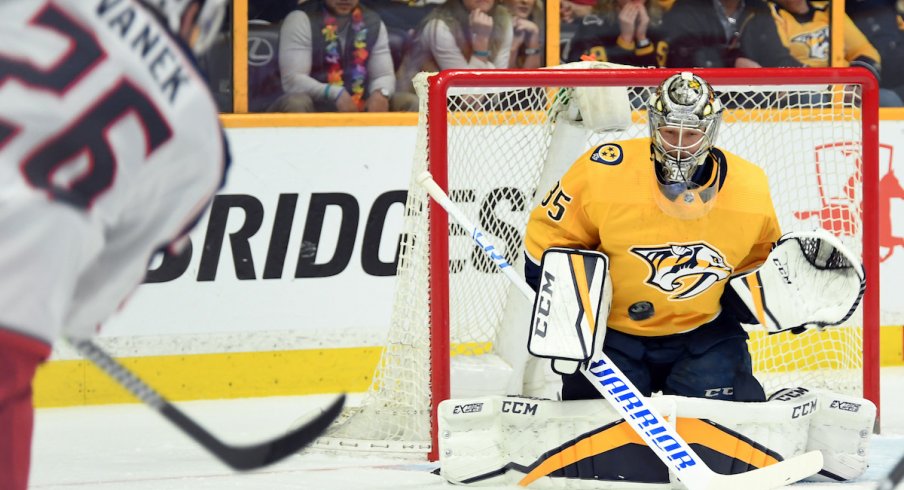 Thomas Vanek fires a shot on Predators goaltender Pekka Rinne.