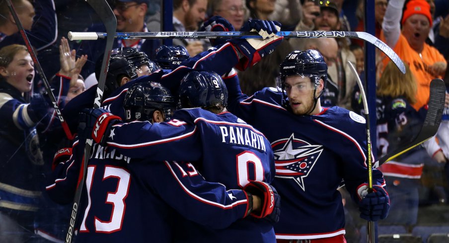 The Blue Jackets celebrate a goal by Cam Atkinson.