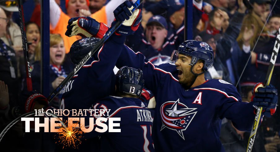 The Blue Jackets celebrate a goal by Zach Werenski against the Penguins.
