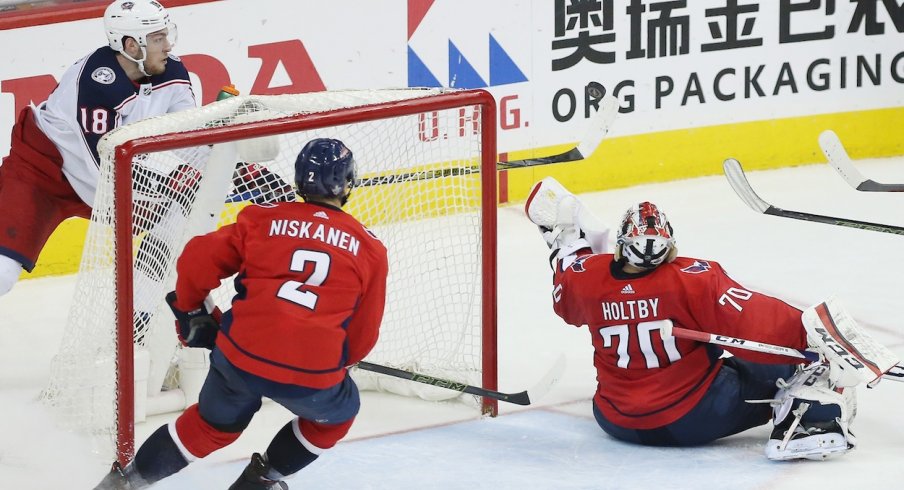 Pierre-Luc Dubois tries to put a puck past Braden Holtby during Game 5