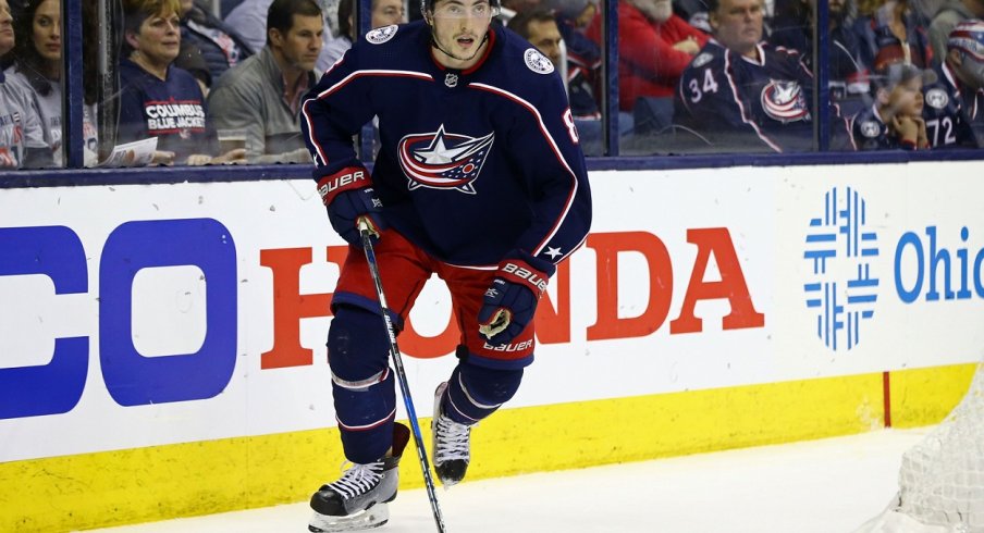 Zach Werenski tries skating with the puck during the Stanley Cup Playoffs