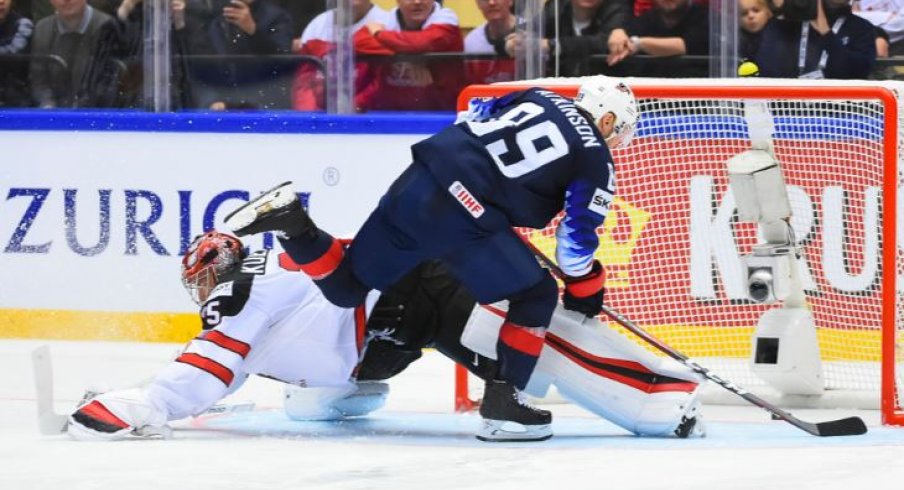 Cam Atkinson sneaks a puck by Darcy Kuemper to help the United States win