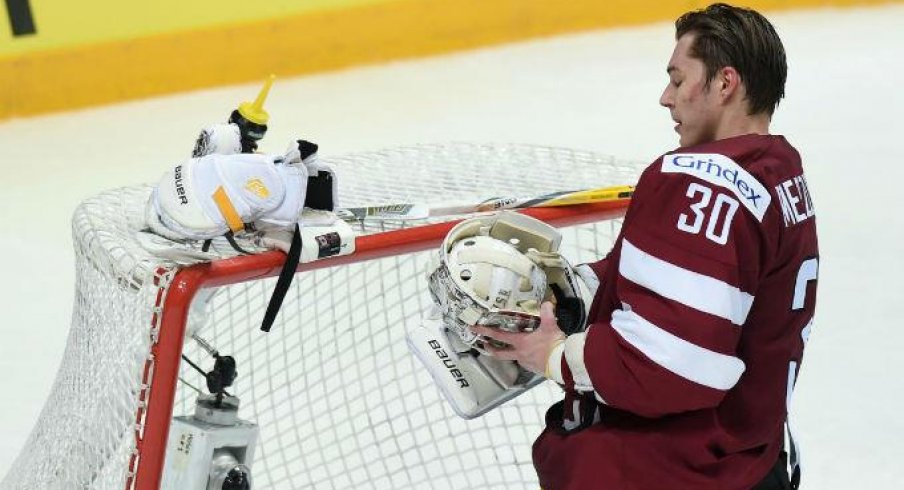 Elvis Merzlikins gets ready for a game as a goaltender for Latvia