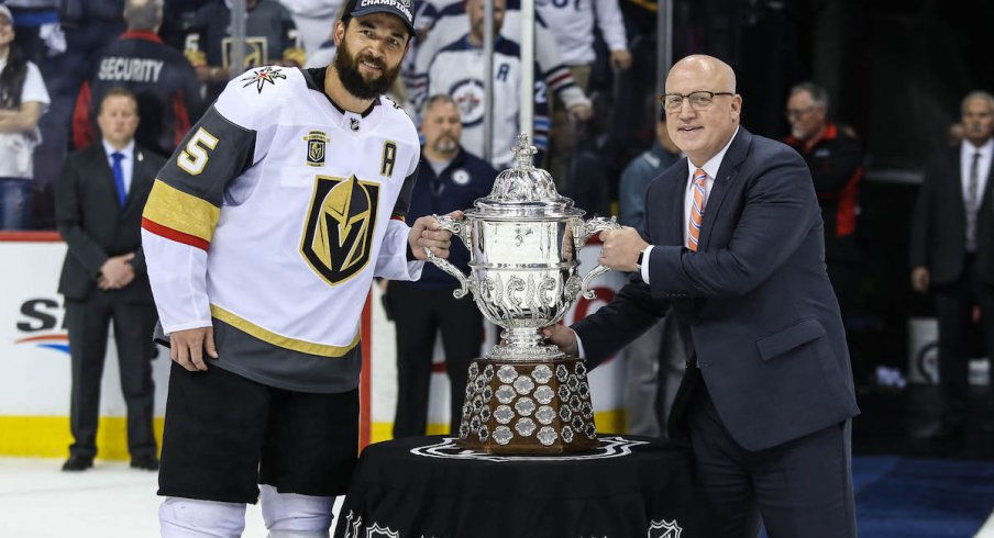 Vegas Golden Knights defenseman Deryk Engelland with NHL deputy commissioner Bill Daly