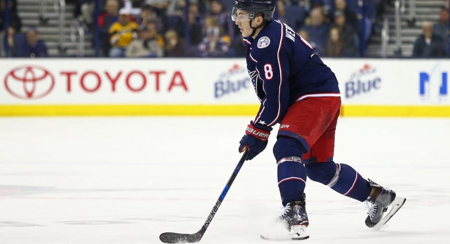 Columbus Blue Jackets defenseman Zach Werenski makes a play up the ice during a game at Nationwide Arena.