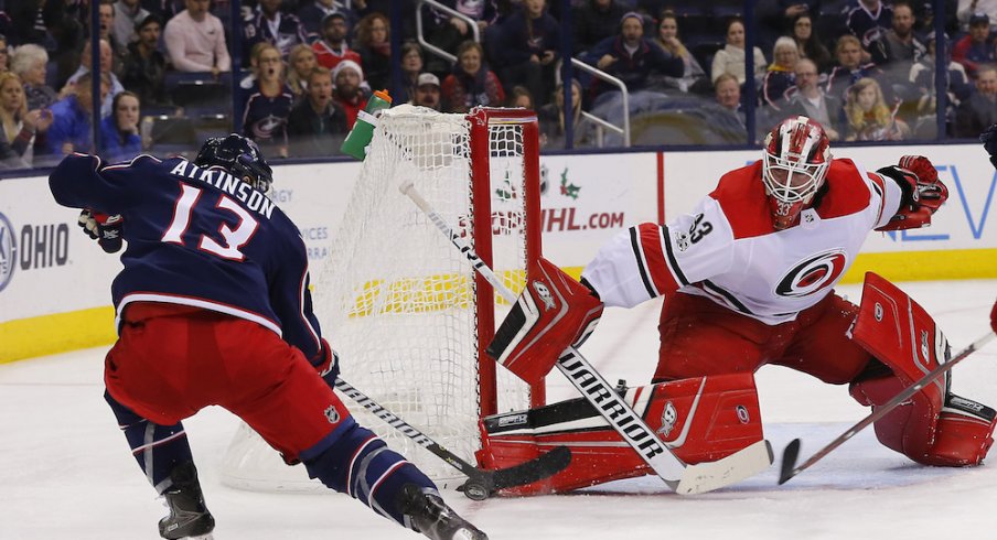Columbus Blue Jackets forward Cam Atkinson tries to beat Hurricanes goaltender Scott Darling during a game at Nationwide Arena.