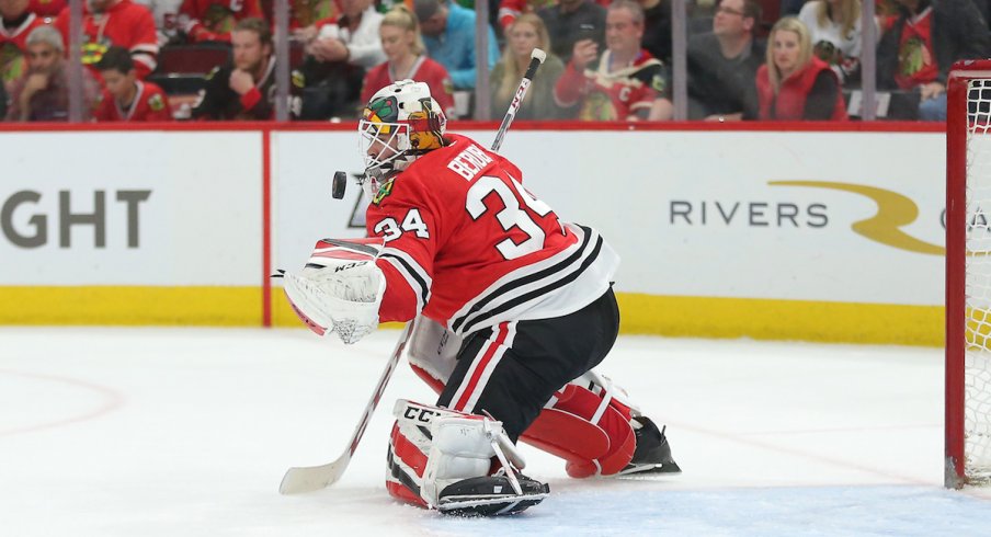 Goaltender Jean-Francois Berube stops a puck during one of his 13 appearances for the Chicago Blackhawks last season.