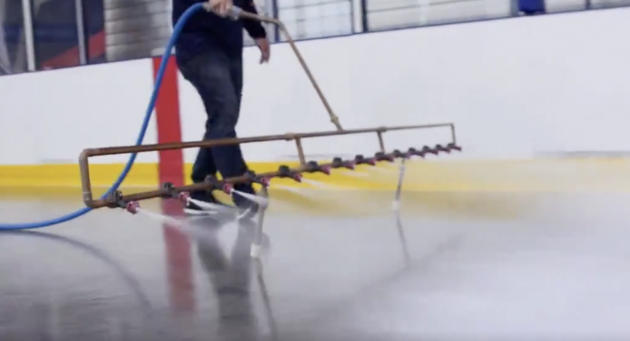 Ice technician Ian Huffman begins to lay a new sheet of ice at the OhioHealth Ice Haus.