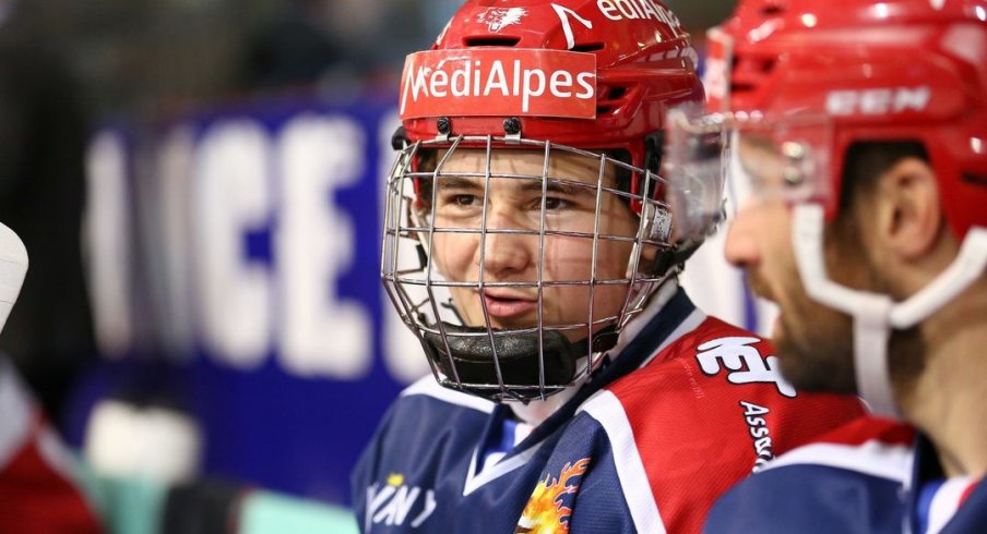 Alexandre Texier talks on the bench during a game