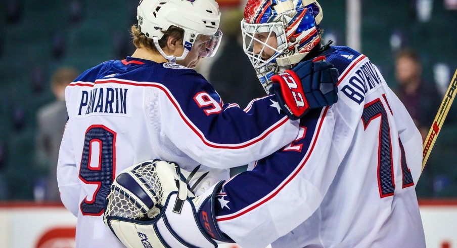 Sergei Bobrvosky and Artemi Panarin celebrate after a win