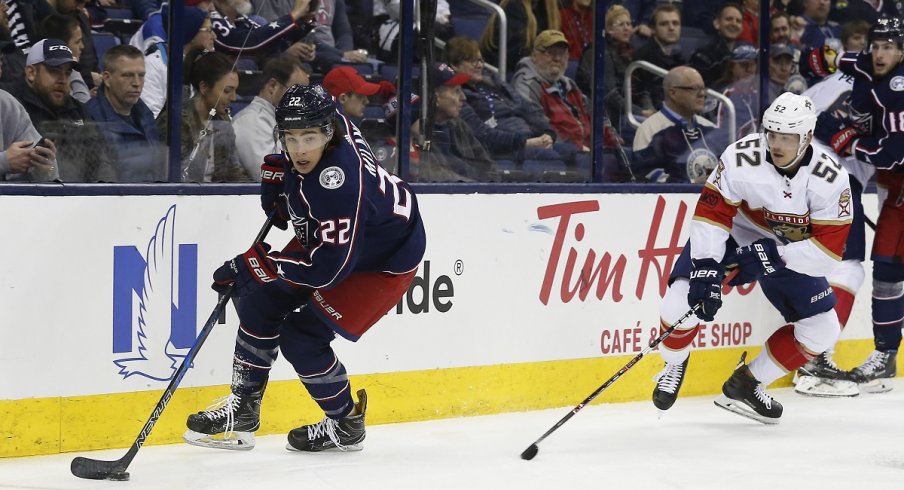 Columbus Blue Jackets forward Sonny Milano skates with the puck in a game against the Florida Panthers at Nationwide Arena.