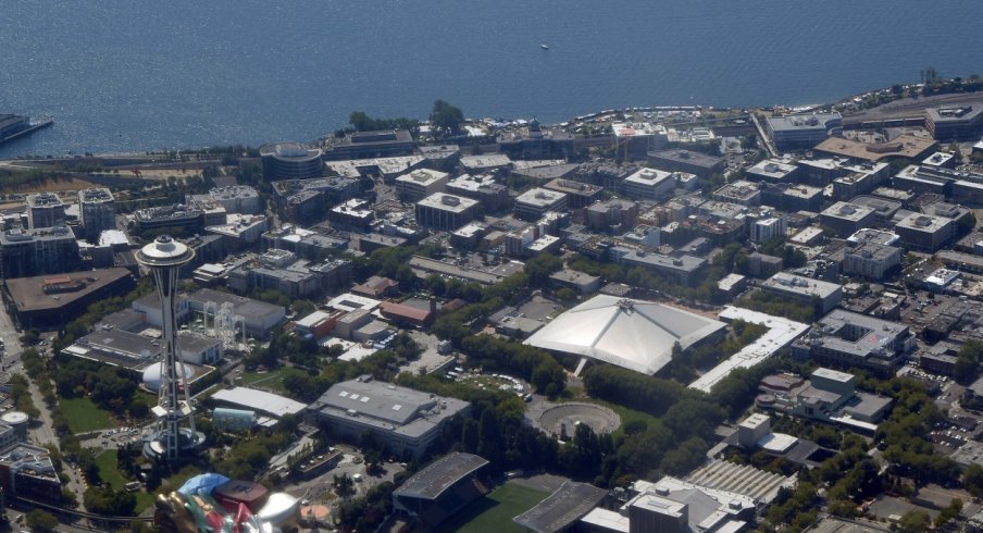 A photo of Seattle from the sky including the Space Needle and Key Arena