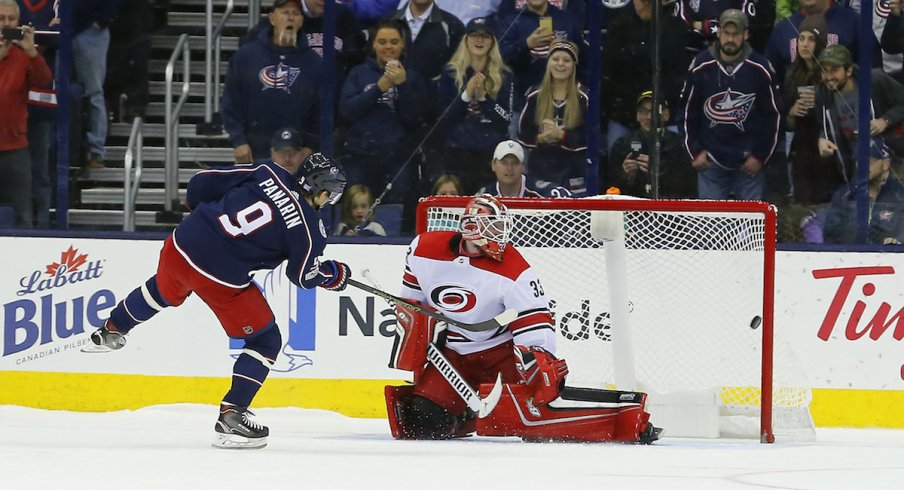 Columbus Blue Jackets forward Artemi Panarin scores a shootout goal against Hurricanes goaltender Scott Darling at Nationwide Arena.