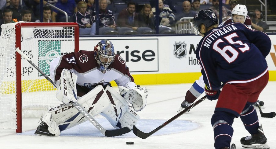 Columbus Blue Jackets defenseman Markus Nutivaara takes a shot on goal against Colorado Avalanche goaltender Philip Grubauer at Nationwide Arena.