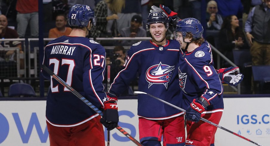 Ryan Murray, Markus Nutivaara and Artemi Panarin celebrate after a third period goal against the Colorado Avalanche on Tuesday.