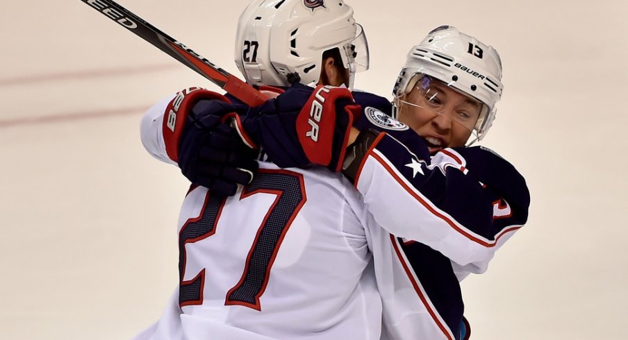 Cam Atkinson and Ryan Murray celebrate scoring against the Panthers
