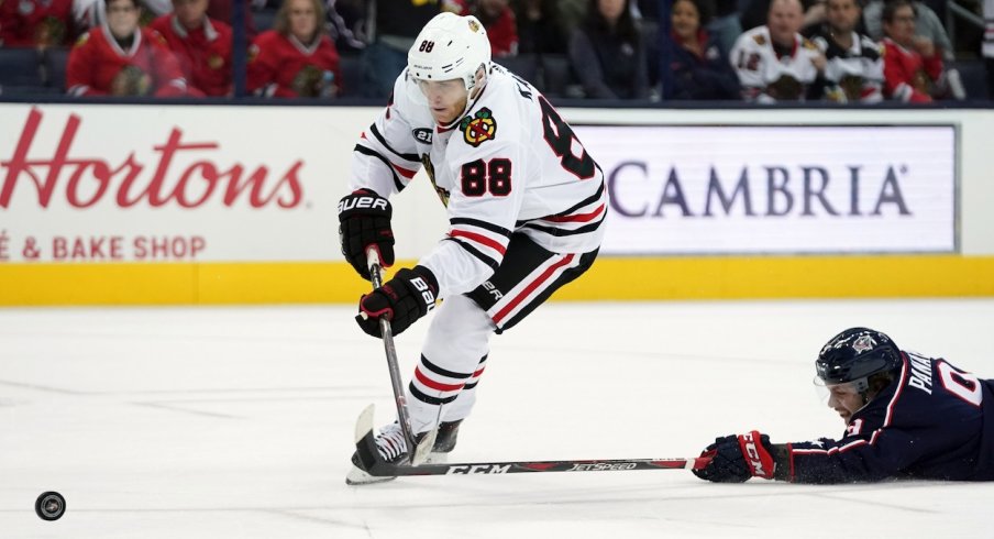 Patrick Kane beats Artemi Panarin down the ice and puts the puck on net.