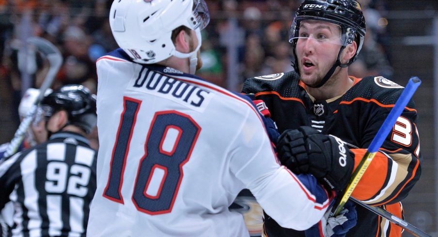 Pierre-Luc Dubois gets into it with Ducks forward Nick Ritchie