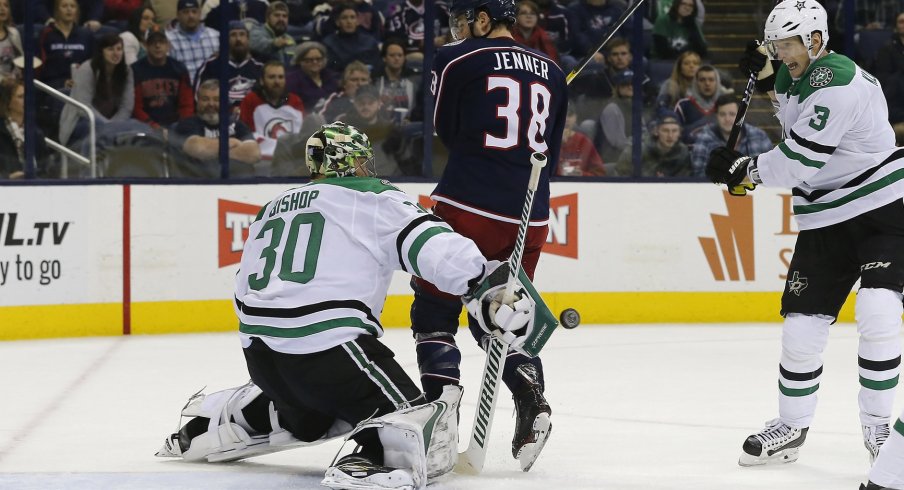 Boone Jenner screens Ben Bishop as a shot comes through