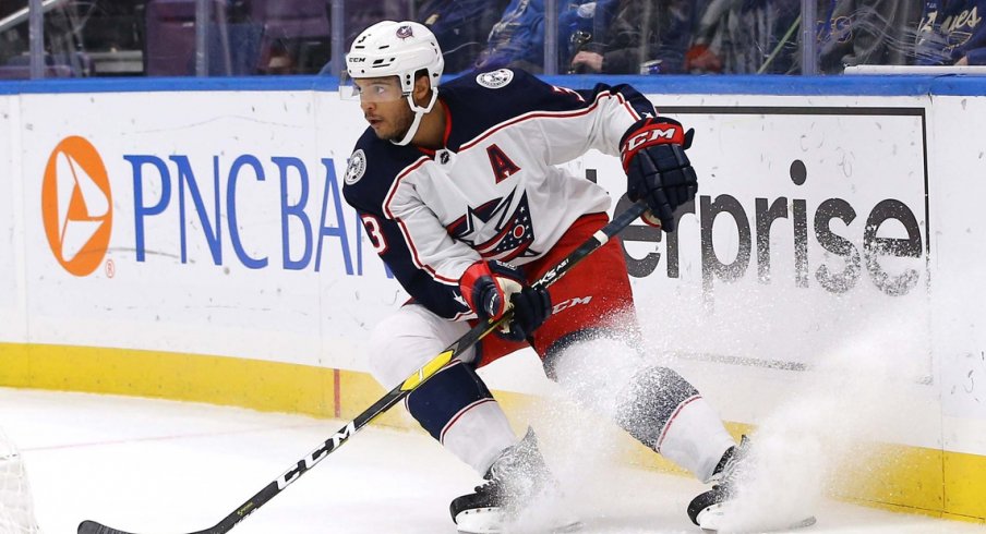 Seth Jones skates with the puck against the St Louis Blues 