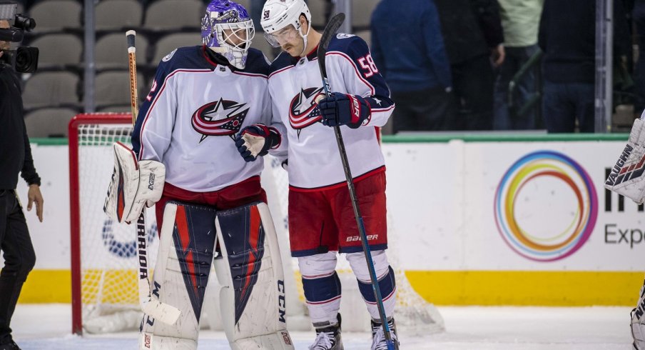 David Savard celebrates a big road win with Sergei Bobrovsky