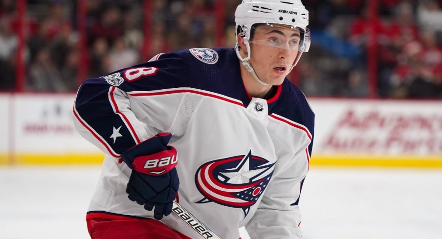 Blue Jackets defenseman Zach Werenski looks for a pass against the Carolina Hurricanes