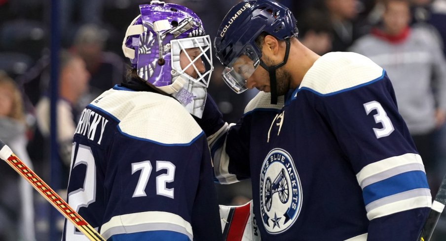 Columbus Blue Jackets defenseman Seth Jones celebrates a 4-2 win over the Minnesota Wild with goaltender Sergei Bobrovsky.