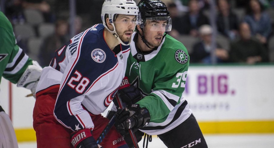 Oliver Bjorkstrand battles in front of the net with Dallas Stars defensemen Joel Hanley