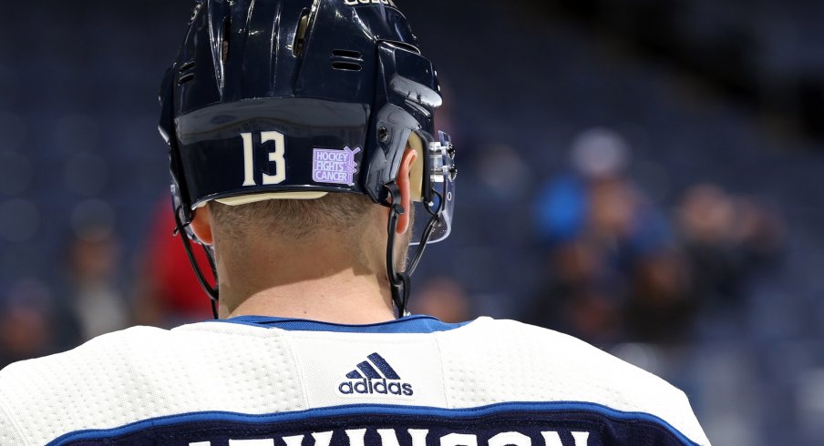 Cam Atkinson wears a Hockey Fights Cancer sticker during pregame warm ups.