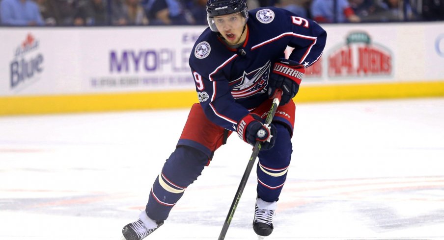 Artemi Panarin skates with the puck against the Los Angeles Kings 