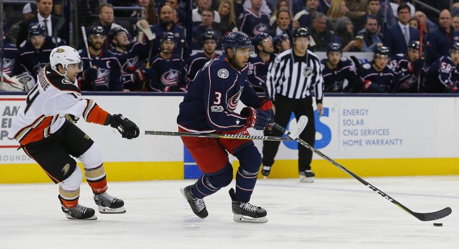 Seth Jones is stick-checked by Adam Henrique as the Blue Jackets dropped a 2-1 game in overtime to the Anaheim Ducks