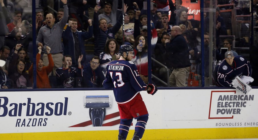 Cam Atkinson reacts to scoring a goal at Nationwide Arena.