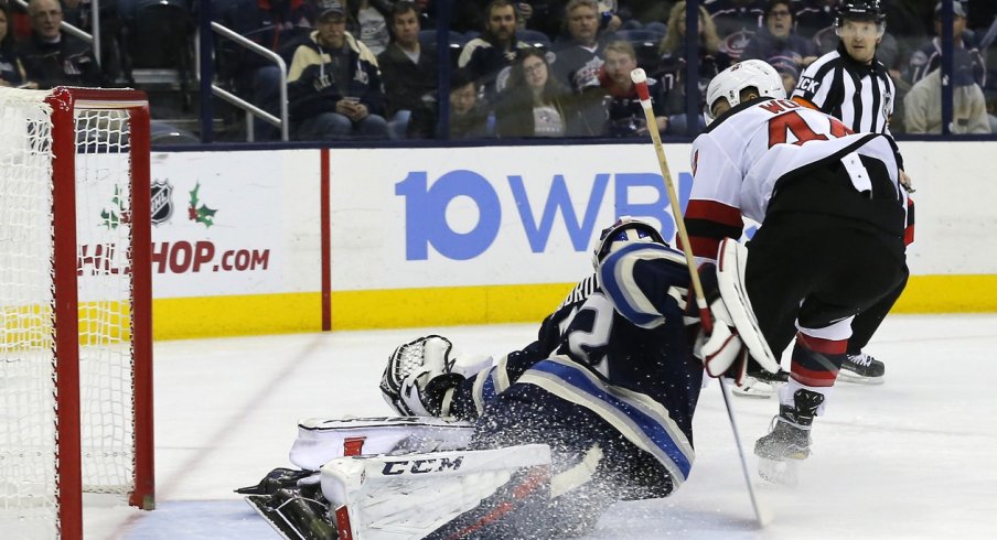 Goaltender Sergei Bobrovsky stops a breakaway attempt from Miles Wood.