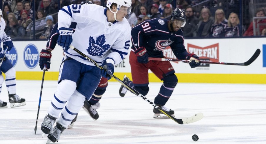 Anthony Duclair tries to chase down the Toronto Maple Leafs Jake Gardiner