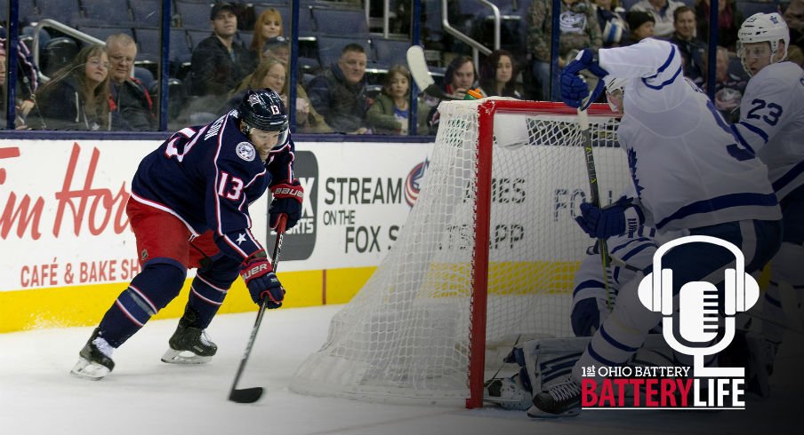 Cam Atkinson tries to find a play to make behind the net against the Toronto Maple Leafs