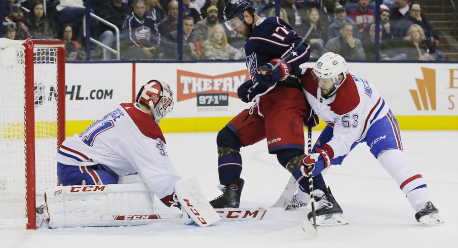 Columbus Blue Jackets center Brandon Dubinsky drives the Montreal Canadiens net guarded by Carey Price during a game at Nationwide Arena.