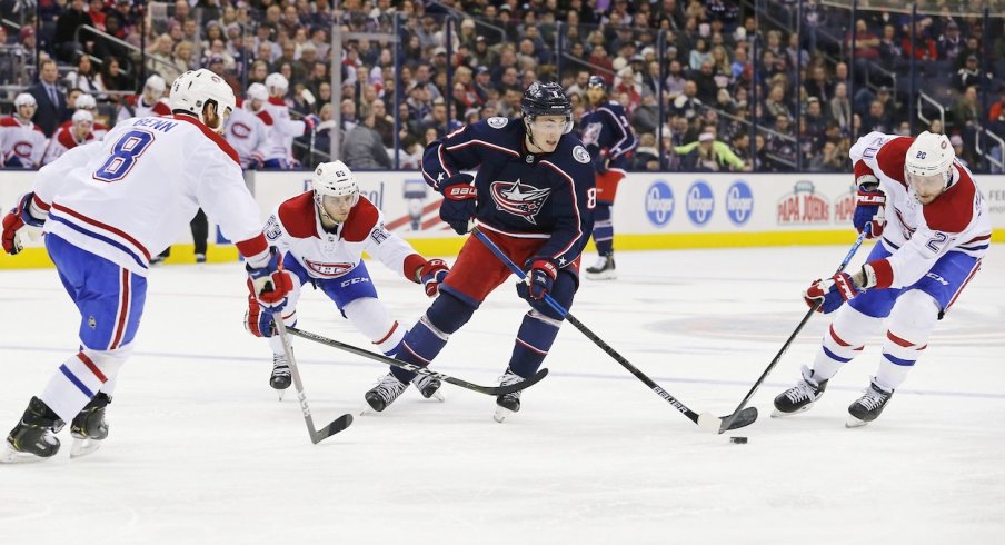 Zach Werenski tries to skate through multiple Montreal Canadiens