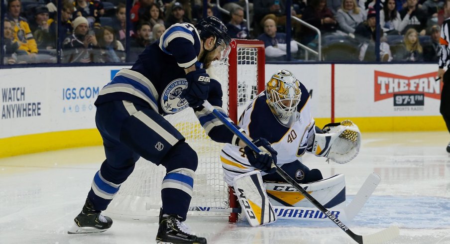 Nick Foligno tries a wraparound during the second period at Nationwide Arena.