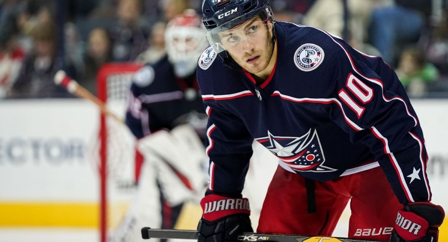 Alexander Wennberg looks to win a faceoff against the Chicago Blackhawks at Nationwide Arena. 