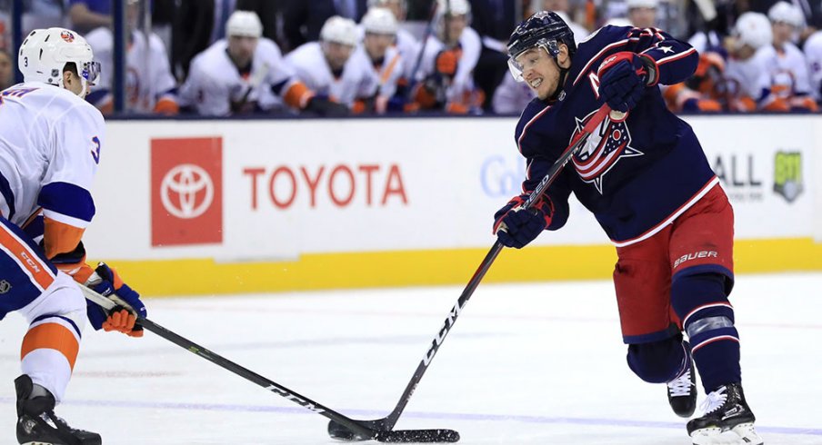 Cam Atkinson shoots the puck against the New York Islanders.