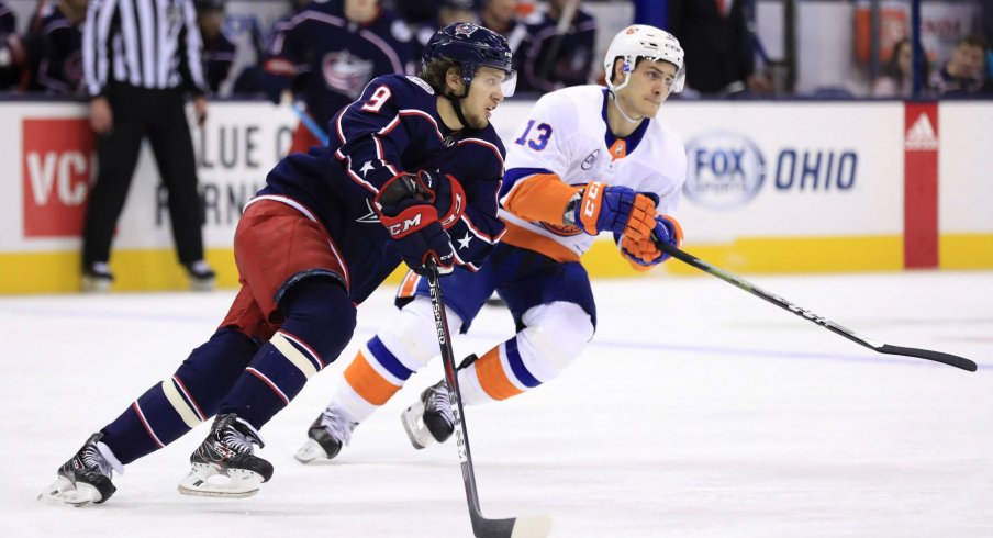 Artemi Panarin skates against Matt Barzal