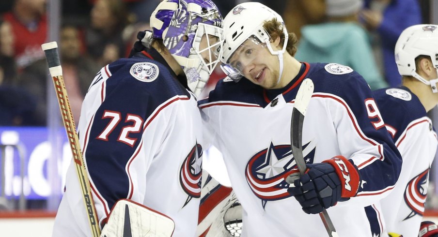 Artemi Panarin and Sergei Bobrovsky celebrate a win. 