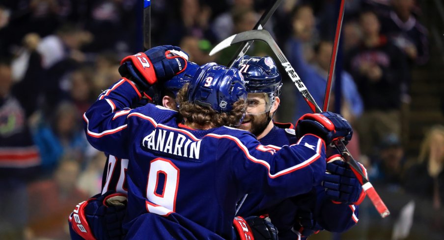 Columbus Blue Jackets forwards Artemi Panarin and Nick Foligno celebrate a goal against the San Jose Sharks at Nationwide Arena.